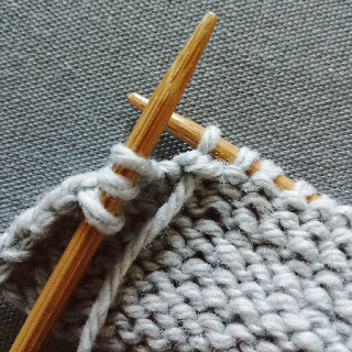 Purl two together through the back loop